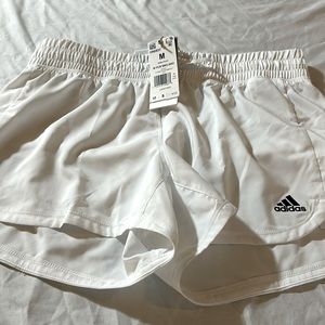 Women’s with tags white Adidas athletic shorts size Medium.